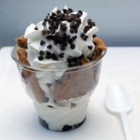 Chocolate Chip Cookie · A warm jumbo chocolate chip cookie split in half on top of Cookie Dough Ice Cream and hot fu...