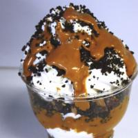 Peanut Butter Crunch · Vanilla Ice Cream with peanut butter sauce, peanut butter cups and chocolate crunch. Topped ...
