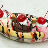 Banana Split · Includes 3 scoops of Ice Cream, a banana, and then topped with hot fudge, strawberry topping...