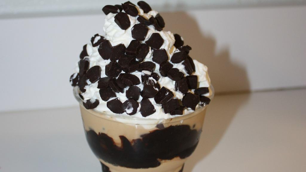 Espresso Bean · Robust Coffee Ice Cream, chocolate cover espresso beans, hot fudge, cookie crunch. Topped with homemade whipped cream, drizzled with chocolate syrup and coffee bits
