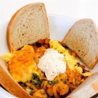 El Matador · breakfast  potatoes mixed with chorizo & jalapenos. topped with scrambled eggs, chipotle cre...
