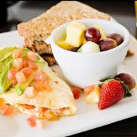 Avocado Egg White Omelette · tomatoes & fresh mozzarella. topped with half of an avocado. served with a fresh fruit cup &...