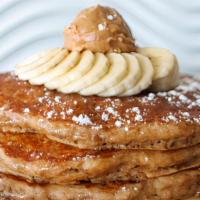 Pb Whole Wheat Pancakes · whole wheat oatmeal pancakes topped with peanut butter, fresh bananas & powdered sugar. driz...