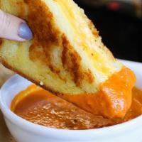 Country Lunch · traditional grilled cheese served on thick cut challah bread. served with cup of tomato soup.