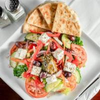 Greek Salad · Romaine lettuce , tomato, cucumber, red onion, pepper, radish, olives, feta cheese and red w...