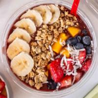 Berries & Acai Bowl · Organic acai,apple juice,bluberry,banana 
Topped with  granola, strawberry and banana.