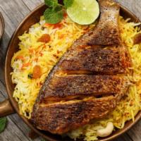 Tilapia Fish & Rice Platter · Fresh and flaky Tilapia, served over a bed of rice. Comes with lettuce, tomatoes and cucumbe...