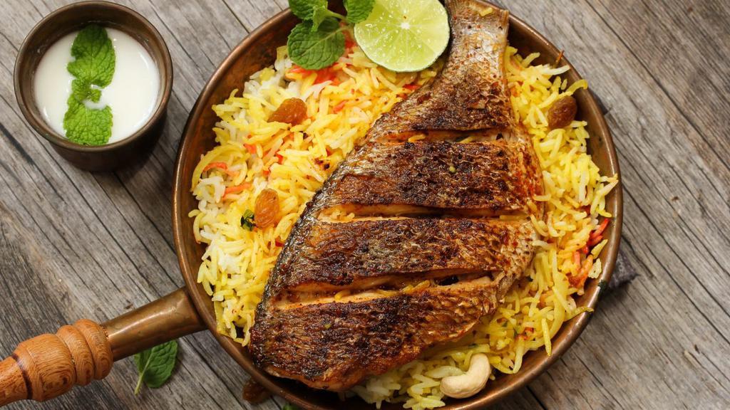 Tilapia Fish & Rice Platter · Fresh and flaky Tilapia, served over a bed of rice. Comes with lettuce, tomatoes and cucumbers.
