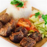 Lamb & Rice Platter · Perfectly seasoned, freshly grilled lamb served over a bed of rice. Comes with lettuce, toma...