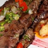 Bistec T-Bone A La Parrilla / Grilled T-Bone Steak · 