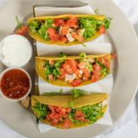 Tacos · Choice of beef or chicken with lettuce, tomato and sour cream on a soft or hard shell.