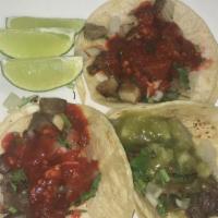 Chorizo Taco · Mexican sausage. Over soft corn tortilla topped with cilantro and onions or lettuce, tomato ...