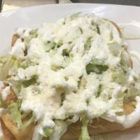 Flautas · Four fried corn tortillas with lettuce, sour cream and cotija cheese.