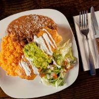 Chimichanga · Flour tortilla filled with your choice of meat and mozzarella cheese topped with sour cream.