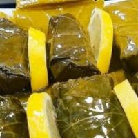 Stuffed Grape Leaves · Grape leaves stuffed with mixture of rice, onions, pine kernels, and mixed herbs.