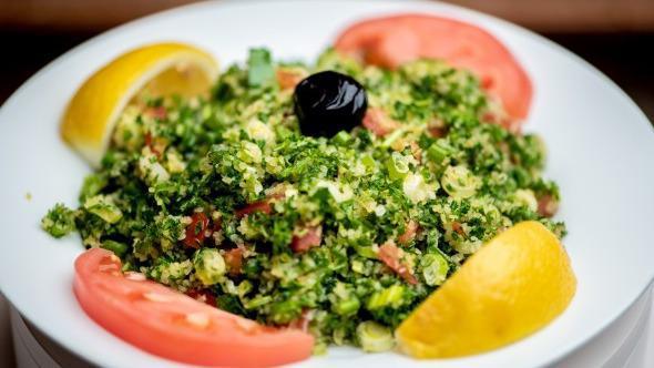 Tabbouleh · A mixture of cracked wheat, green onions, tomato, and parsley.