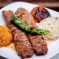 Adana Kebab · Skewered ground lamb. Flavored with red bell peppers, slightly seasoned with paprika, and gr...