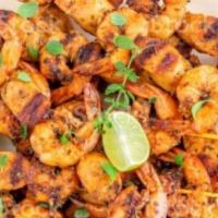 Grilled Shrimp Kebab · Grilled jumbo shrimp served with steamed vegetables and rice.