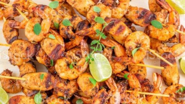 Grilled Shrimp Kebab · Grilled jumbo shrimp served with steamed vegetables and rice.