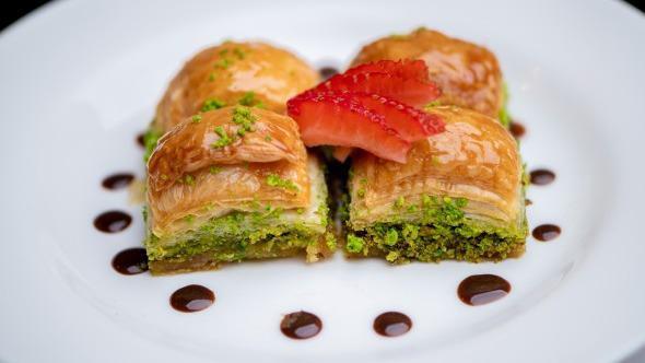Baklava · Turkish pastry made of many layers of paper thin dough filled with crushed pistachios.