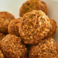 Falafel · A mixture of ground chickpeas and broad beans tossed in spices and deep fried.