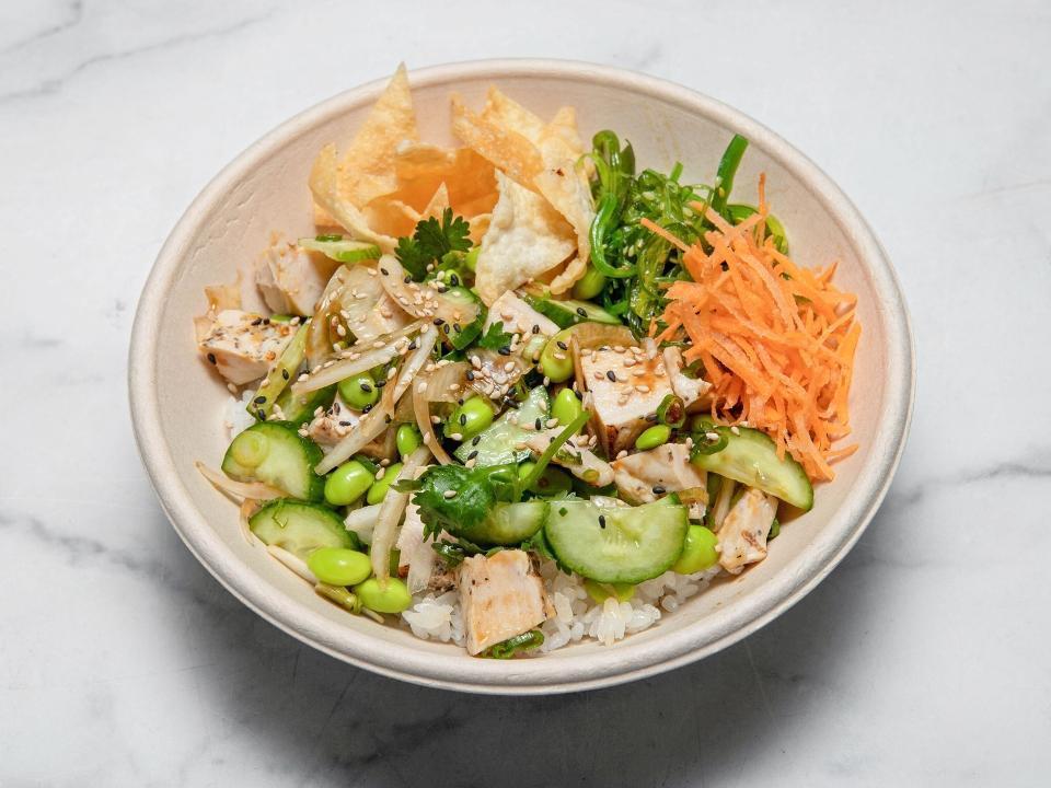 Chicken Bowl · Classic sauce, grilled chicken, carrots, cucumber, sweet onion, edamame, cilantro, seaweed salad, green onion, sesame, wonton crisps.