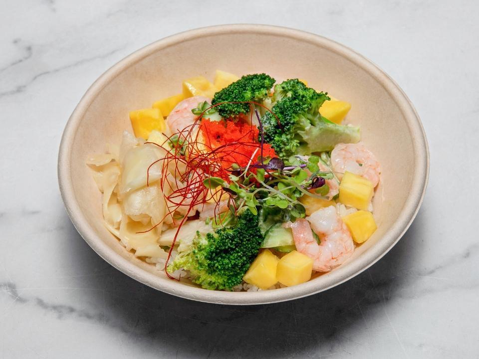 Mango Shrimp Bowl · Shrimp, radish sprouts, broccoli, cucumber, scallion, red pepper, masago, mango chunks, wasabi aioli and ginger sauce.