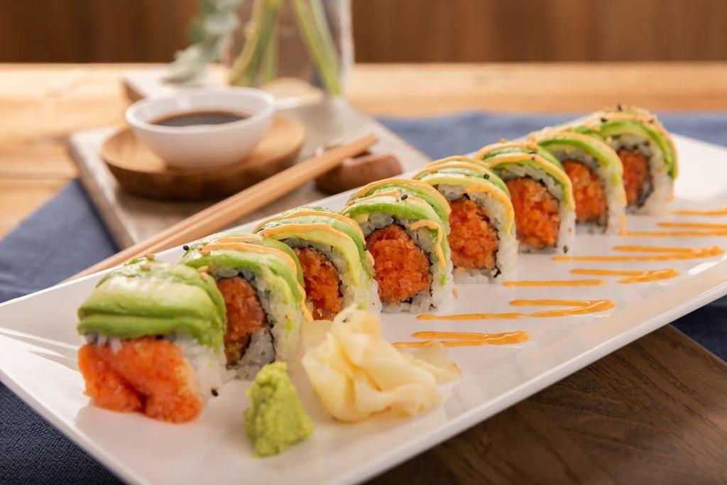 Godzilla Roll (8 Pcs) · Spicy tuna, crunch & tobiko inside, topped with avocado