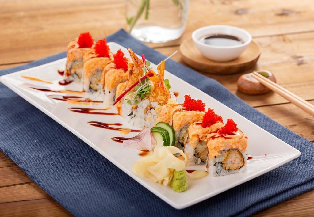 Koi Special Roll · shrimp tempura, cucumber top with spicy lobster salad, tobiko & gold flakes