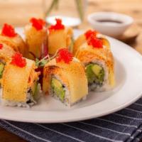 Unstoppable Avocado Roll · avocado, cucumber, asparagus inside, top with kani salad,  tobiko & cheese slice