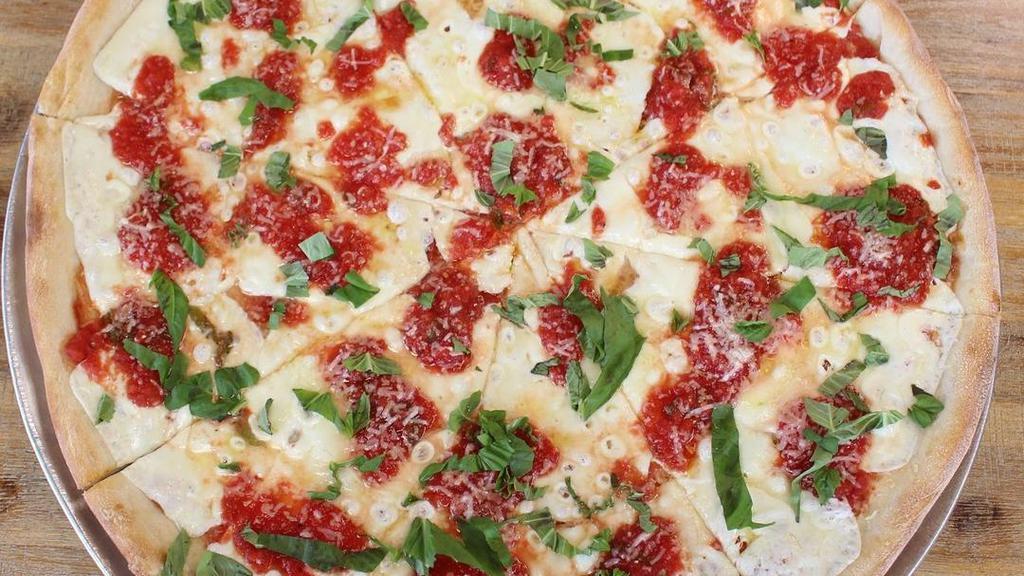 Margherita Pizza · Fresh mozzarella, tomato sauce, grated Parmesan cheese, olive oil and basil.