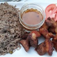 Griot (Fry Pork) · Spicy. Pork shoulder marinated in homemade spice mixture, braised, and then fried *serve wit...
