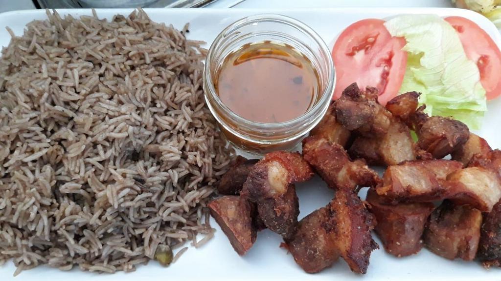 Griot (Fry Pork) · Spicy. Pork shoulder marinated in homemade spice mixture, braised, and then fried *serve with choice of rice & fry plantain.