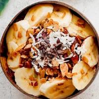 Nutty Cacao Bowl · Acai bowl topped with  granola, bananas, cacao nibs, peanut butter, and almond slices.