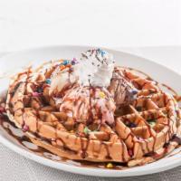 Belgian Waffles · Served with ice cream, whipped cream and chocolate syrup.
