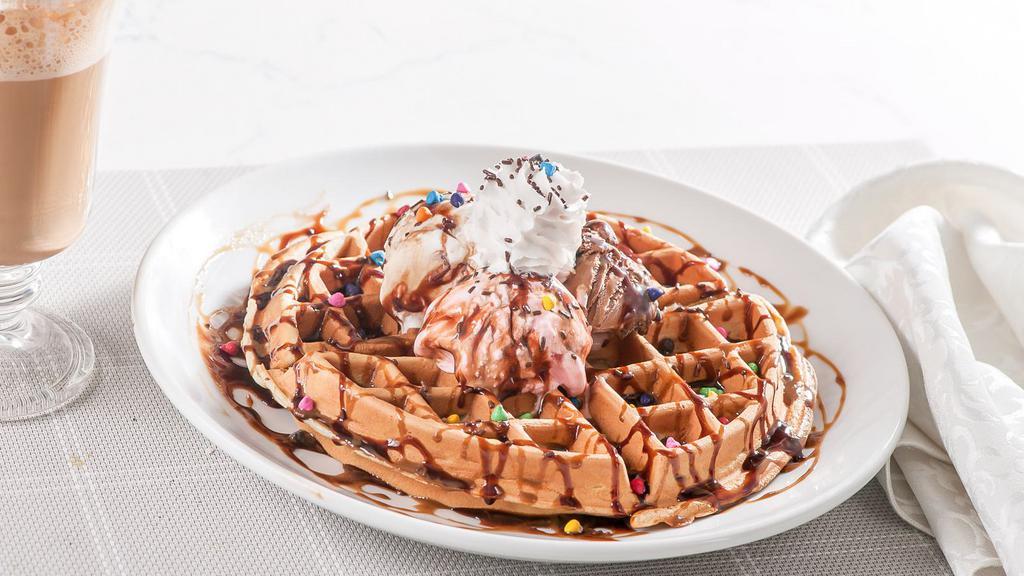 Belgian Waffles · Served with ice cream, whipped cream and chocolate syrup.