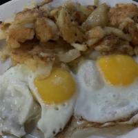 Two Eggs Any Style · Served with potatoes or grits or salad and toast.