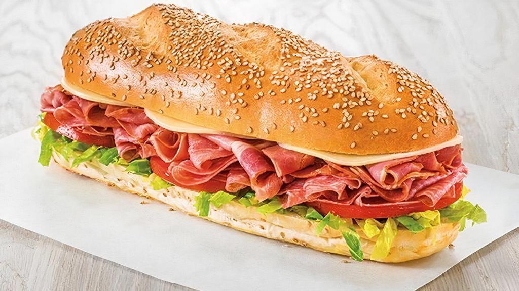 Italian Assorted · Genoa salami and capicola with lettuce, tomato, onion, roasted red peppers with mayonnaise and DiBella's Famous Oil dressing, topped with provolone cheese on a fresh-baked sesame roll. Customize it to make it your own!
