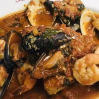 Swordfish Marechiara · Sautéed with clams, mussels, and shrimp, tomato, basil, garlic sauce.