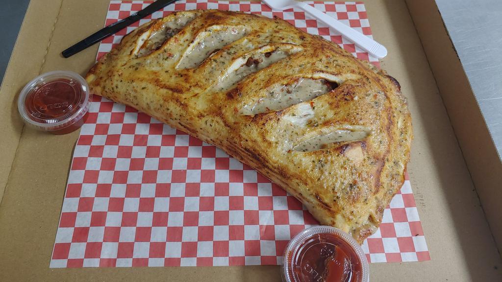 Cheese Calzone · Ricotta cheese, mozzarella cheese and choice of one topping.