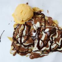 Fettuccine Crepe · Sliced crepe topped with vanilla ice cream and chocolate.