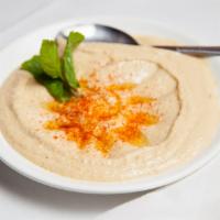 Hummus · Mashed chickpeas with tahini, lemon juice, and garlic.