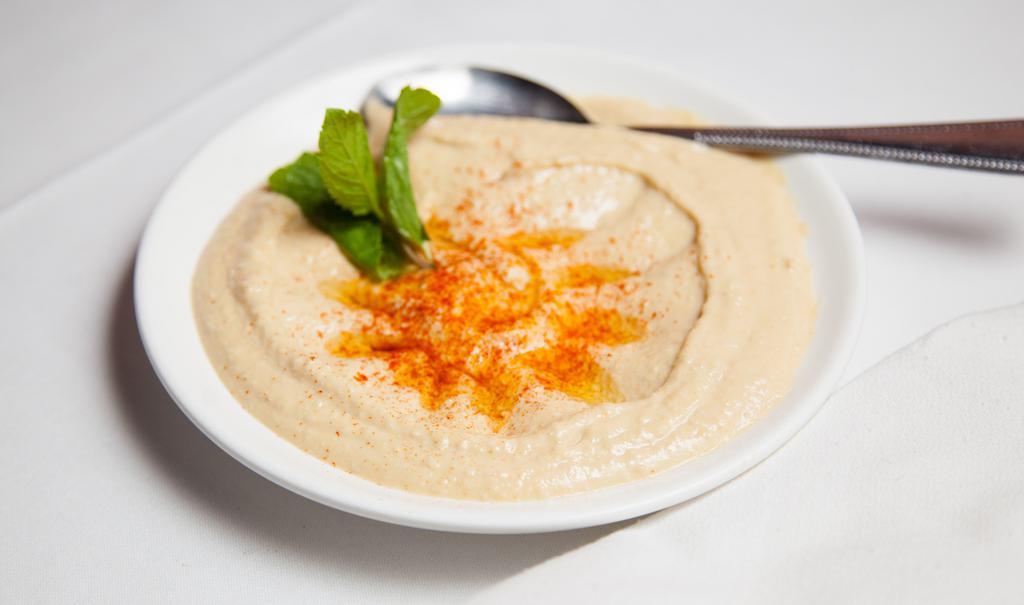 Hummus · Mashed chickpeas with tahini, lemon juice, and garlic.