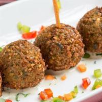 Falafel · Small croquettes of mashed and mixed chickpeas,
cilantro, garlic, and scallion.