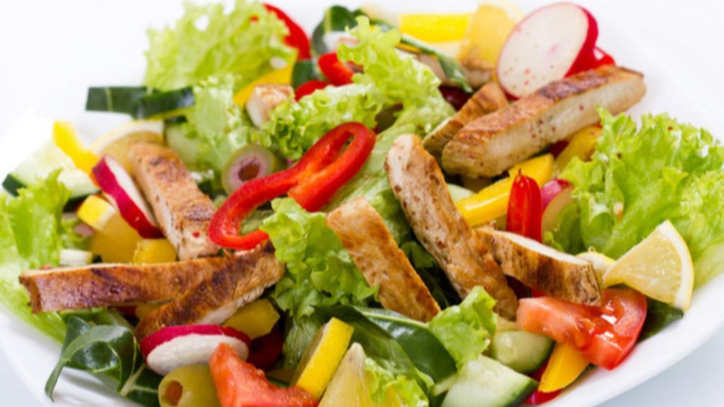 Fiesta Chicken Salad · Fresh salad with grilled chicken, romaine lettuce, tomatoes, carrots, onions, roasted peppers, and topped with oil and vinegar.
