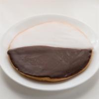 Black And White Cookie · Soft, cakey cookies covered in a thick layer of icing flavored with both vanilla and chocola...