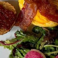Cheddar Biscuit Brekkie Sandwich · Soft scrambled eggs, gruyere cheese, thick cut bacon and house-made tomato chutney on a fres...