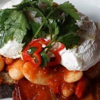 Rustic Chorizo Baked Beans On Toast · Gigante & chorizo baked beans, 2 poached eggs and bacon on  multi grain toast