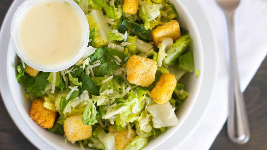 Caesar Salad · Romaine lettuce, caesar dressing, croutons and grated parmesan cheese and parmigiano-reggiano.