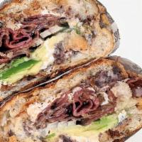 The Ludlow · The Ludlow is a hot press sandwich that contains: black beans, red onions, queso Oaxaca, pas...